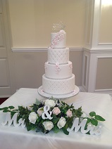 4 tier pink & white sparkly wedding cake